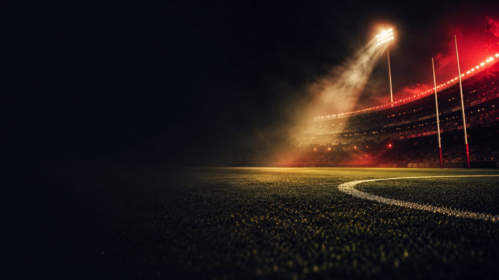 Floodlit football stadium at night through atmospheric haze